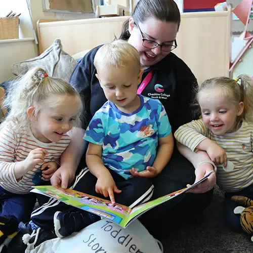 Early Years student reading to children