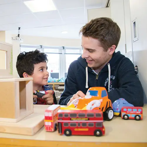 Early Years student with a child