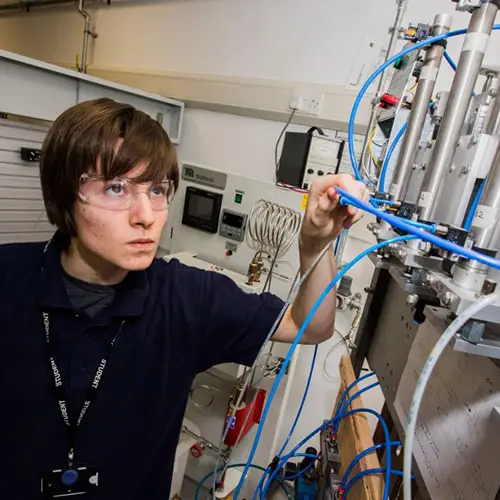 Engineering student using pneumatic equipment