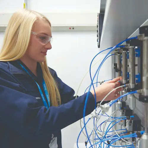 Engineering student using pneumatic equipment