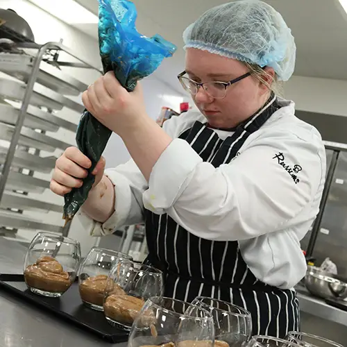 Catering student preparing desserts