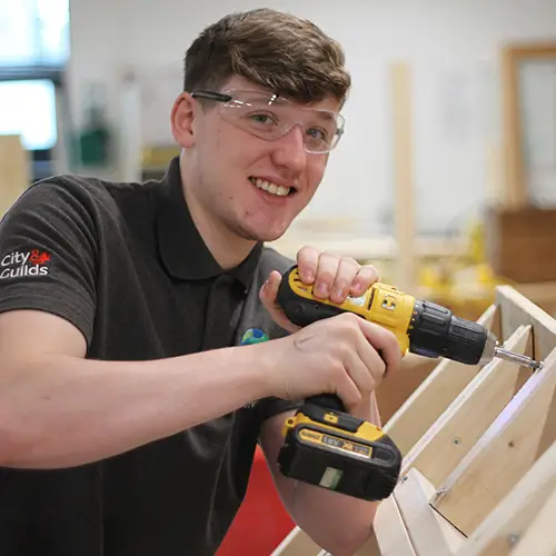 Carpentry student working on roof structure