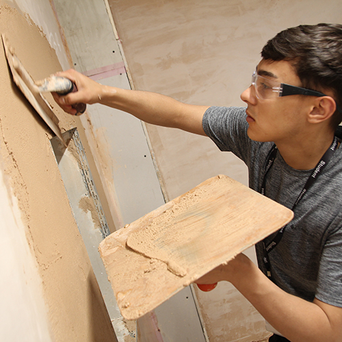 Plastering student