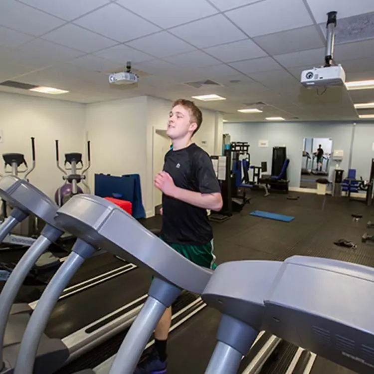student running on treadmill
