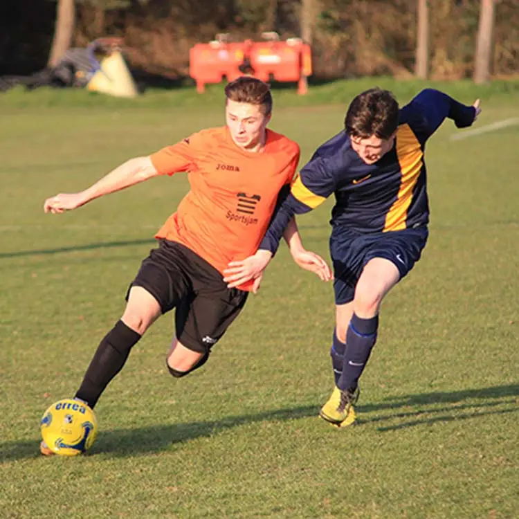 two students playing football