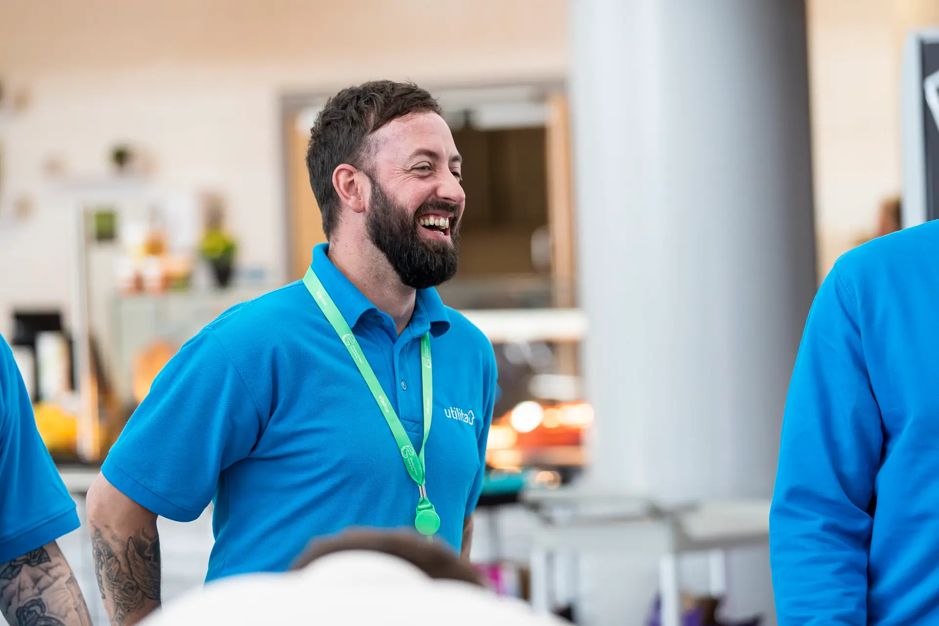 Laughing Male in Blue Shirt